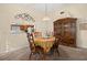 Dining room with wooden table and chairs, view to living room at 5846 Greenbriar Ct, Zephyrhills, FL 33542