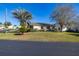 Single-story home with landscaped yard and driveway at 5846 Greenbriar Ct, Zephyrhills, FL 33542