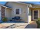 House entrance with a bench and a small patio area at 5846 Greenbriar Ct, Zephyrhills, FL 33542