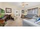 Bright living room featuring comfortable seating and a fireplace at 5846 Greenbriar Ct, Zephyrhills, FL 33542