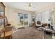 Sunroom with backyard access and workspace at 5846 Greenbriar Ct, Zephyrhills, FL 33542