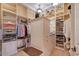 Organized walk-in closet with built-in shelving, drawers, and ample hanging space at 6918 Belmont Ct, Lakewood Ranch, FL 34202