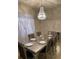 Elegant dining room with a large table and chandelier at 6327 Yellow Buckeye Dr # 6327, Riverview, FL 33578