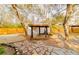 Backyard gazebo and patio area featuring stone pavers and established landscaping at 10020 Jungle St, New Port Richey, FL 34654
