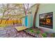 Backyard featuring stone pavers, blue door, native trees and established landscaping at 10020 Jungle St, New Port Richey, FL 34654