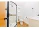 Modern bathroom with a curved glass shower, updated fixtures, and clean white vanity at 10020 Jungle St, New Port Richey, FL 34654