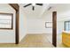 Spacious living room featuring new floors, wood beams, and natural light at 10020 Jungle St, New Port Richey, FL 34654
