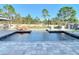 Modern rectangular pool with tanning ledge and stone coping at 16304 Scaup Duck Ave, Weeki Wachee, FL 34614