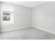 Neutral bedroom with carpet, window, and simple, clean design at 5936 Jensen View Ave, Apollo Beach, FL 33572