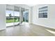 Open living room with sliding glass doors, providing a seamless indoor-outdoor flow at 5936 Jensen View Ave, Apollo Beach, FL 33572