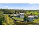 Aerial view showcasing the property's location on the water, a canal and pasture at 501 Chastain Rd, Seffner, FL 33584