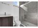 Modern bathroom with a walk-in shower, dark wood vanity, and contemporary fixtures at 501 Chastain Rd, Seffner, FL 33584