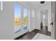 Modern bathroom with glass shower, French doors to a balcony, and dark wood-style flooring at 501 Chastain Rd, Seffner, FL 33584