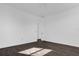 Spacious, unfurnished bedroom with dark wood-style flooring and white walls at 501 Chastain Rd, Seffner, FL 33584
