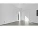 Bright, spacious bedroom with white walls, gray tile flooring, and white closet doors at 501 Chastain Rd, Seffner, FL 33584