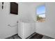 Laundry room with washer, dryer, and overhead cabinets at 501 Chastain Rd, Seffner, FL 33584