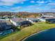 Aerial view of house and neighborhood near a lake at 19512 Sea Glass Cir, Land O Lakes, FL 34638