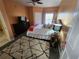 A compact bedroom features a queen bed, dresser and soft, patterned floor covering at 4333 Bayside Village Dr # 314, Tampa, FL 33615