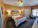Inviting bedroom with ceiling fan, natural light, and seating at 4333 Bayside Village Dr # 314, Tampa, FL 33615