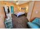 Bedroom featuring ceiling fan, carpet, side tables and a blue chair at 4333 Bayside Village Dr # 314, Tampa, FL 33615