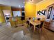 Bright dining room features a wooden table with art on the walls, and bar top at 4333 Bayside Village Dr # 314, Tampa, FL 33615