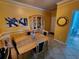 Dining area with a table and chairs, china cabinet, plus artwork on the wall at 4333 Bayside Village Dr # 314, Tampa, FL 33615