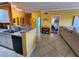 A full view of the kitchen into the dining area that flows into the main bedroom at 4333 Bayside Village Dr # 314, Tampa, FL 33615