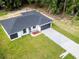 Aerial view of a single-story house, showcasing its layout and landscaping at 22112 Mamaroneck Ave, Port Charlotte, FL 33952