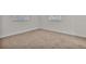 Bare bedroom with wall-to-wall carpet and plain walls at 407 Belvedere Oval, Temple Terrace, FL 33617