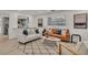 Bright living room featuring hardwood floors and an open layout at 407 Belvedere Oval, Temple Terrace, FL 33617