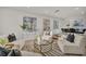 Airy living room with plush seating, natural light, and direct access to dining area at 407 Belvedere Oval, Temple Terrace, FL 33617