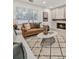 Cozy living room with a fireplace, comfortable sofas, and stylish decor at 407 Belvedere Oval, Temple Terrace, FL 33617