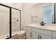 Contemporary bathroom featuring a walk-in shower, toilet, and vanity with modern fixtures at 9071 Players Dr, Weeki Wachee, FL 34613