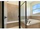 Beautiful bathroom showcasing a walk-in shower with a built-in bench and a relaxing soaking tub at 9071 Players Dr, Weeki Wachee, FL 34613