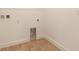 The laundry room has a utility sink hookup with wood look tile flooring at 9071 Players Dr, Weeki Wachee, FL 34613