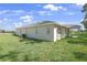 Spacious backyard with lush lawn and ample space for outdoor activities and relaxation at 9109 Players Dr, Weeki Wachee, FL 34613