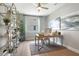 Bright and airy home office with stylish shelving, modern desk, and hardwood floors at 9109 Players Dr, Weeki Wachee, FL 34613