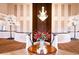 Elegant foyer featuring a chandelier, table, and white faux trees at 9157 Players Dr, Weeki Wachee, FL 34613
