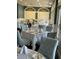 Restaurant dining area with tables, chairs, and elegant table settings at 9157 Players Dr, Weeki Wachee, FL 34613