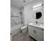A spacious, marble tiled bathroom with a tub at 183 Wright Drive, Rotonda West, FL 33947