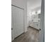 Bathroom with double sinks, tiled floor, and closet at 183 Wright Drive, Rotonda West, FL 33947