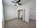 Spacious bedroom with tile flooring, closet, ceiling fan, and a bright window at 183 Wright Drive, Rotonda West, FL 33947