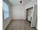This bedroom features neutral paint, tiled floors and a closet system at 183 Wright Drive, Rotonda West, FL 33947