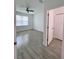 Bright and spacious bedroom with tile floors, ceiling fan, and closet at 183 Wright Drive, Rotonda West, FL 33947