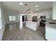 An open concept living area connecting kitchen and living spaces, promoting a spacious atmosphere at 183 Wright Drive, Rotonda West, FL 33947