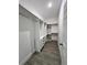 Custom walk-in closet with shelving and drawers for optimal storage and organization at 183 Wright Drive, Rotonda West, FL 33947