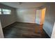 Bedroom featuring wood-look floors and a closet provides a comfortable and stylish living space at 7403 Foxbloom Dr, Port Richey, FL 34668