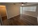 Bedroom boasts modern ceiling fan, a closet, and wood-look floors, enhancing the home's appeal at 7403 Foxbloom Dr, Port Richey, FL 34668