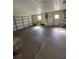 Spacious garage with roll-up doors and plenty of room for storage at 7403 Foxbloom Dr, Port Richey, FL 34668