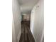 Hallway with new wood laminate flooring leading to the living room at 7403 Foxbloom Dr, Port Richey, FL 34668